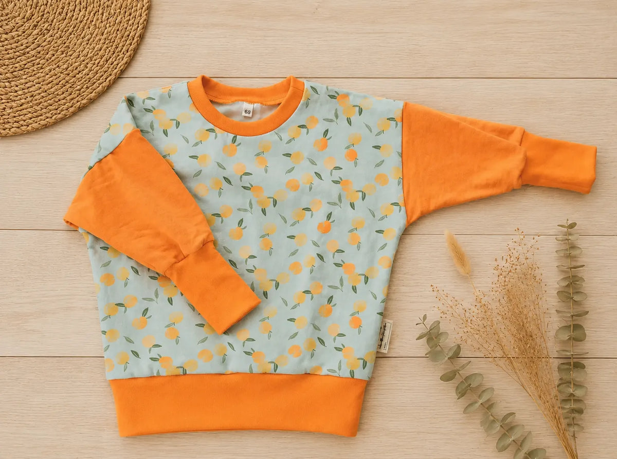 Baby-Pullover mit Pfirsiche
