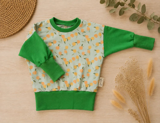 Baby-Pullover mit Pfirsiche